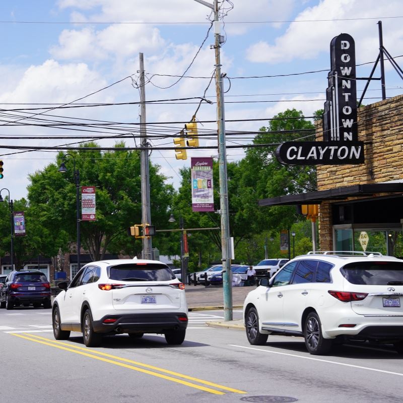 Dotnown clayton Main Street with Downtown Clayton Sign